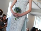 an ice blue lace embellished sheath wedding dress, with a train and a strapless neckline for a queen-like look