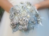 a sparkling ice blue and silver vintage brooch wedding bouquet is a magical idea for an ice queen look