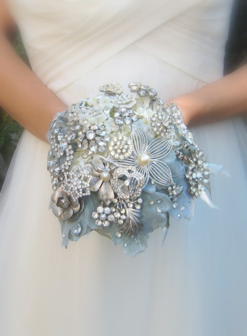 a sparkling ice blue and silver vintage brooch wedding bouquet is a magical idea for an ice queen look