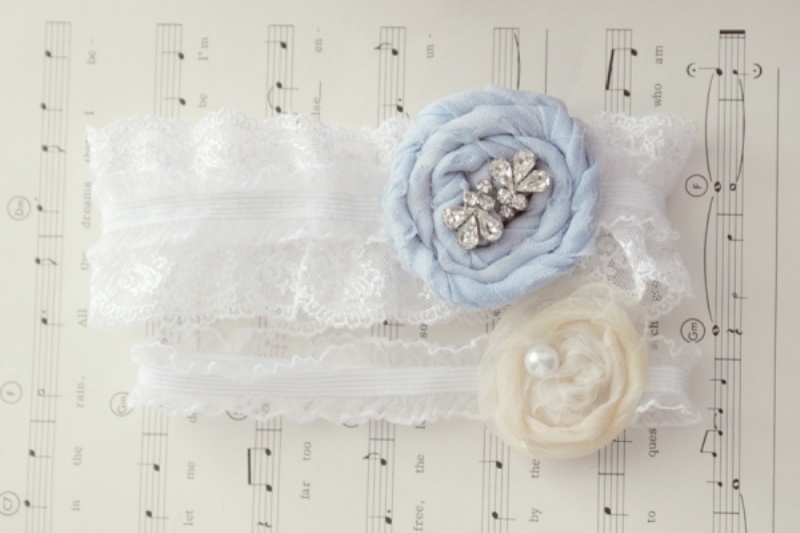White lace garters with neutral and ice blue fabric blooms and beads look amazing