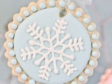an ice blue snowflake cookie will be a fit for your dessert table or a cool winter wedding favor
