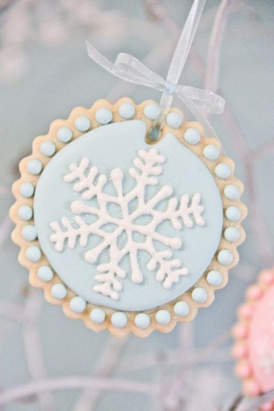 An ice blue snowflake cookie will be a fit for your dessert table or a cool winter wedding favor