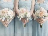 ice blue bridesmaid dresses with thick straps and draped bodices for a frozen winter wedding
