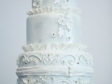 a vintage-inspired ice blue and white embellished and patterned wedding cake is a lovely and beautiful idea