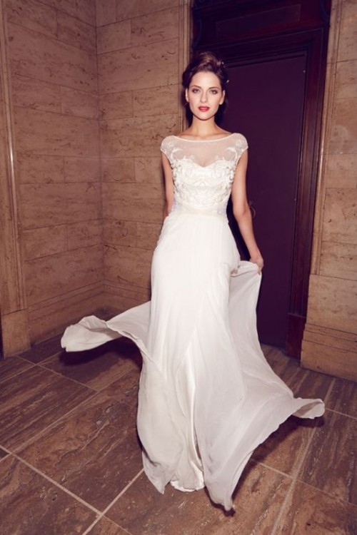 a beautiful modern A-line cap sleeve wedding dress with an illusion lace applique bodice and an airy skirt
