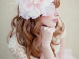 an oversized pink and neutral fabric bloom headpiece is a unique solution for a vintage-loving bride, it will make you stand out