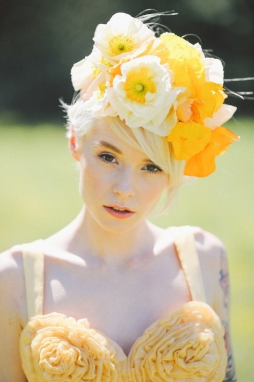 an oversized white and yellow flower crown that matches a bold yellow wedding dress and can make your look ultimate and super bold