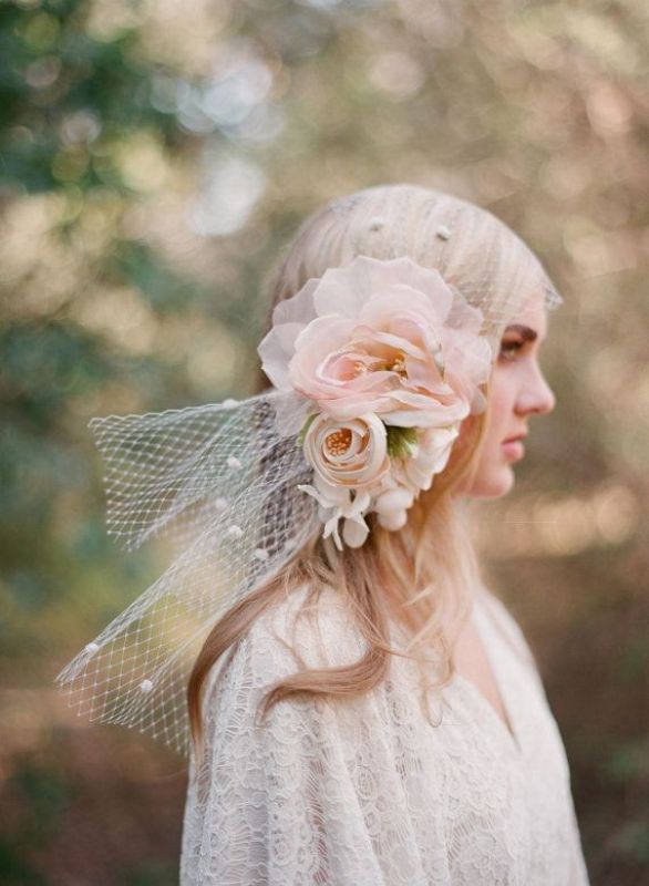 a cap veil with oversized fabric blooms is a great and romantic idea for a spring romantic bride