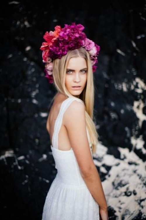 a statement orange and hot pink, fuchsia flwoer bridal crown is a gorgeous idea for a tropical boho bride