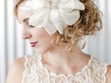oversized white fabric blooms with vintage brooches are amazing for adding a chic and lovely touch to your vintage bridal look