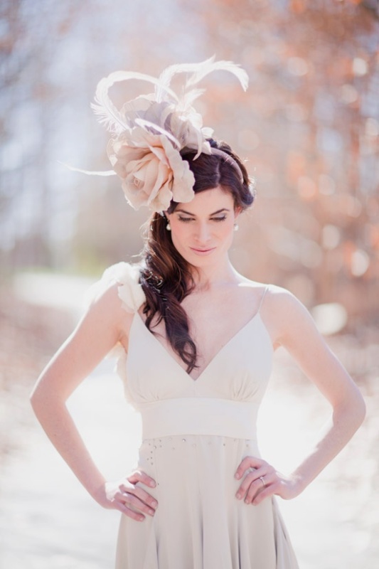 An oversized fabric flower headpiece with feathers will give a whimsical and chic touch to your bridal look making it a bit vintage