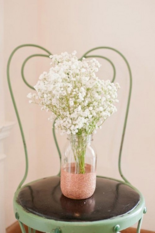 a rose gold glitter jar with baby's breath for a romantic wedding centerpiece or just decor