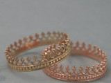 a gold and rose gold crown-like wedding ring for a couple