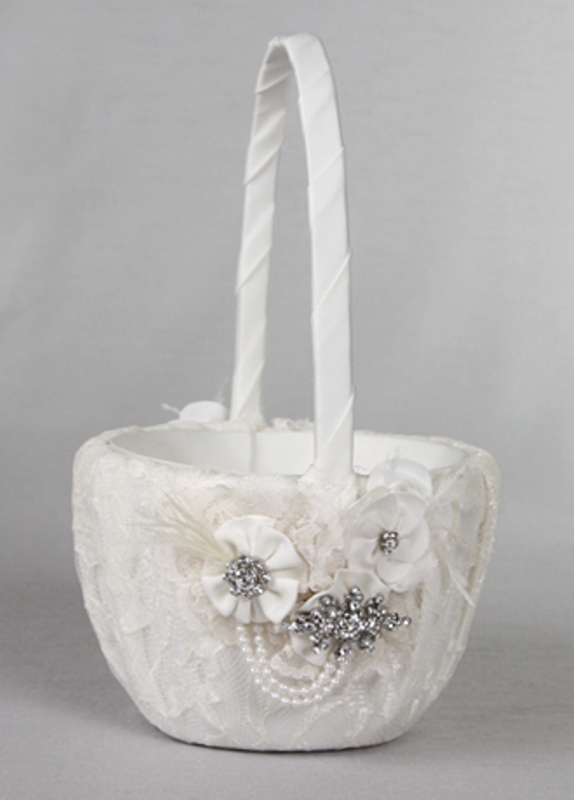 a lace wedding basket for petals decorated with white ribbon blooms with brooches and brooches themselves