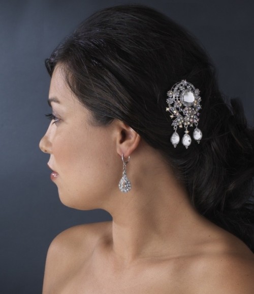 a large rhinestone vintage brooch as a hair accessory is a lovely idea for a vintage bride