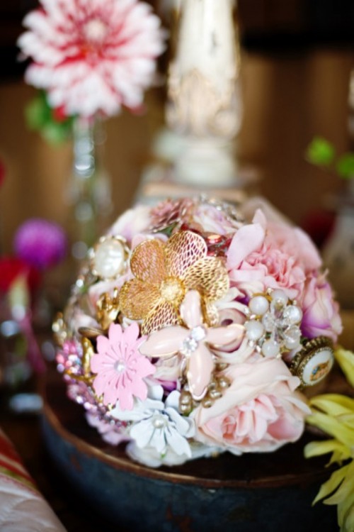a unique wedding bouquet composed of vintage brooches and pastel blooms is a lovely idea for a vintage bride