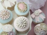 pastel cupcakes topped with vintage brooches are amazing for a vintage or shabby chic wedding