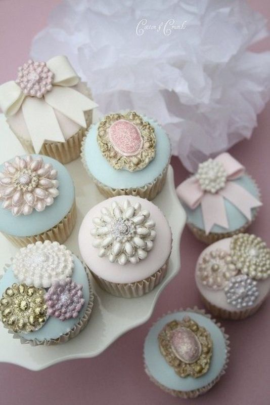 pastel cupcakes topped with vintage brooches are amazing for a vintage or shabby chic wedding