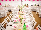 colorful lace paper buntings and hot pink paper pompom garlands make the reception space look bold and fun