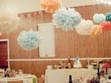 pastel, red and white paper pompoms hanging on lights over the space will create a festive feel in the venue easily