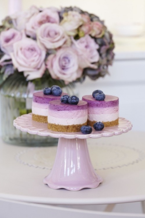 lilac-colored mini cheesecakes topped with blueberries are nice desserts for a lilac wedding