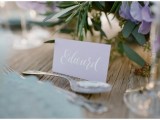 a lavender-colored place card with calligraphy is a chic and stylish idea