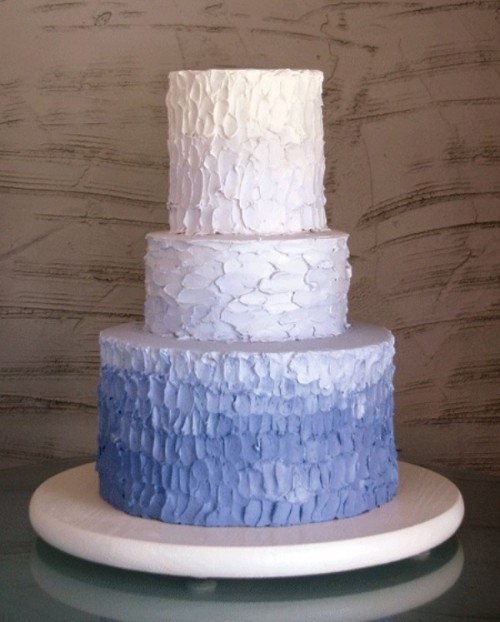 a textural white and lilac wedding cake with an ombre effect is a chic and stylish idea