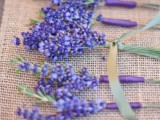 bright lavender boutonnieres are cool to accent groom’s and groomsmen’s attire