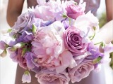 a pink and lavender colored wedding or bridesmaid bouquet looks like a large candy