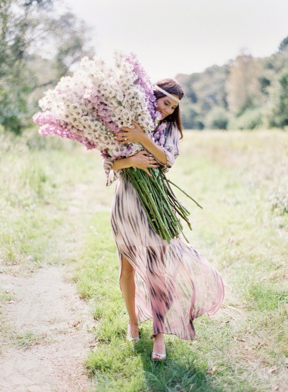 an oversized wedding bouquet done in neutrals and lavender shades for a boho summer bride