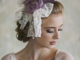 a unique vintage wedding headpiece of white lace and lilac feathers for a beautiful accent