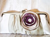 a vintage-inspired silk clutch with a lavender-colored fabric flower for a vintage bride