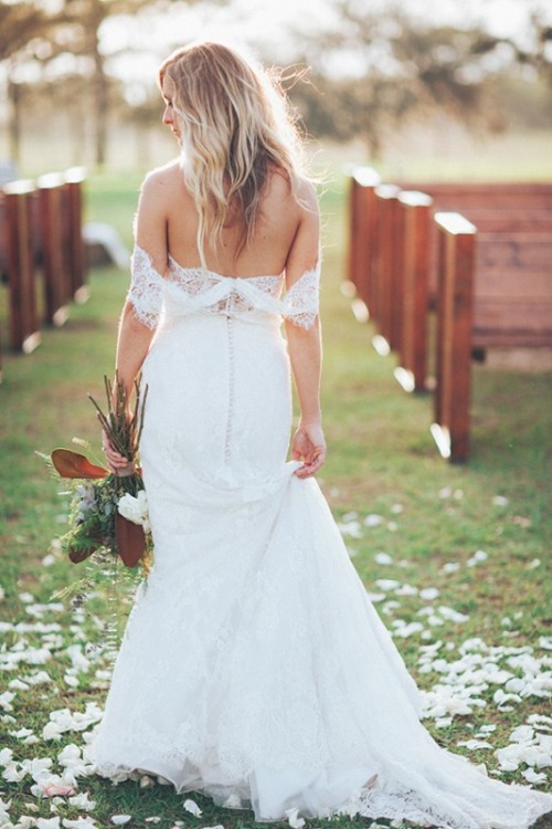 a lace mermaid off the shoulder wedding dress with a train is a very chic, romantic and feminine idea for a wedding