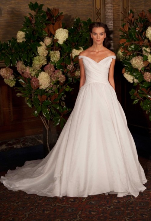 a gorgeous off the shoulder wedding ballgown with a draped bodice and a skirt with a train is a lovely idea for a refined and formal wedding