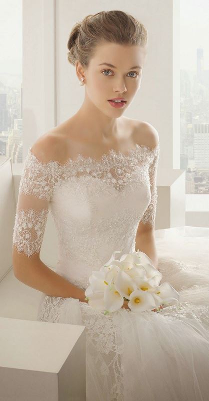 a refined vintage-inspired off the shoulder wedding dress with short sleeves and shiny sivler lace for a chic vintage formal wedding