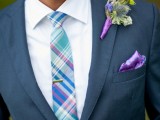 a bold blue, purple and mint printed tie, a purple pocket square and a green boutonniere with a purple wrap