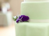 a gentle green wedding cake with a touch of purple