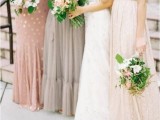 mismatching neutral bridesmaid dresses – a pink one shoulder polka dot one, strapless grey, creamy and blush dresses