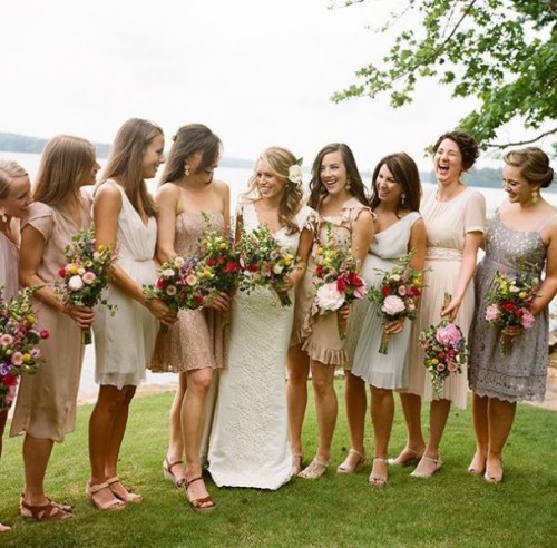 a super mismatching assrotment of neutral bridesmaid dresses, knee and midi ones, with various types of detailing is great