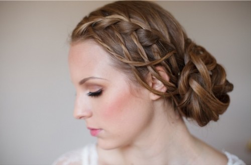 multiple side braids and a large braided low knot is a creative idea for those who love braids a lot
