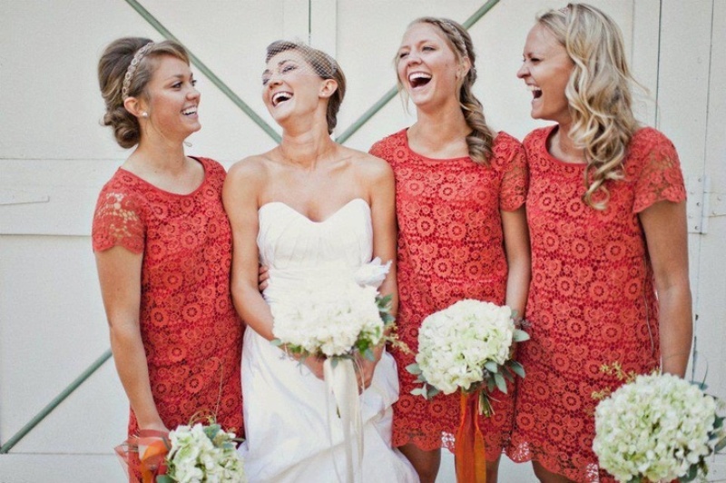 Coral lace short bridesmaid dresses with a high neckline and short sleeves are classics for a spring or summer wedding