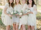mismatching neutral lace bridesmaid dresses over the knee and matching coverups for a spring or summer wedding