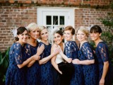 navy lace A-line bridesmaid dresses with scoop necklines and short sleeves are classic for many weddings