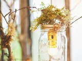 jars with bulbs and moss on top are nice for a woodland or fairy tale wedding