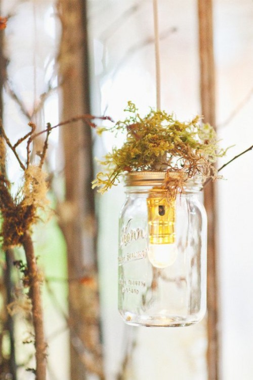 jars with bulbs and moss on top are nice for a woodland or fairy tale wedding