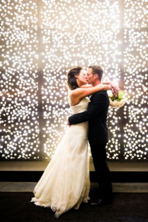 a lit up wall is a classic lighting idea for a wedding, it's very romantic and it brings a wow factor to the space