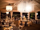 white chandeliers with crystals hanging down from lampshades and an oversizedsquare crystal chandelier as a centerpiece