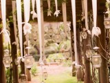 whimsical vintage candle lanterns hanging on ribbons are great for styling your venue or ceremony space
