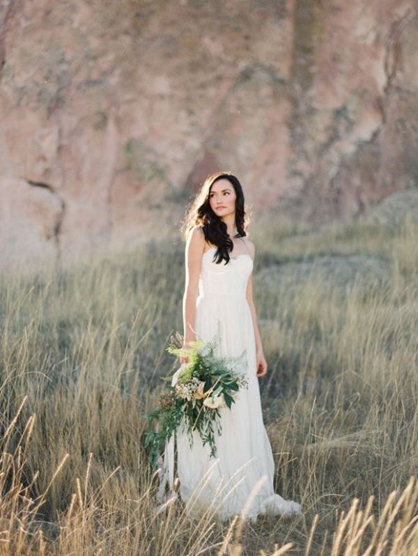 A modern strapless plain wedding dress with a bustier is a stylish idea that always works