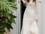 a romantic fitting boho lace wedding dress with a deep neckline, long sleeves and a train